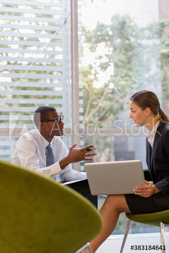 Corporate business people with laptop talking in meeting