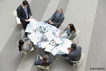 Corporate business people with paperwork in conference room meeting