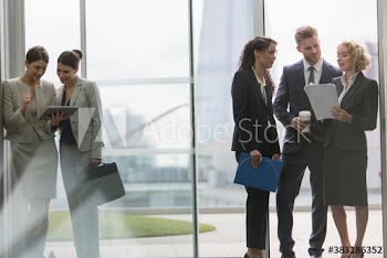 Corporate business people working and talking in office