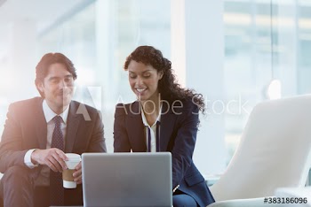 Corporate business people working at laptop
