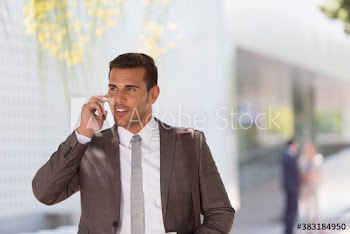 Corporate businessman talking on smart phone