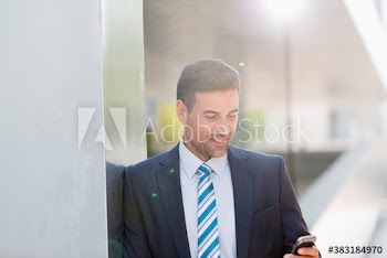 Corporate businessman using mobile phone