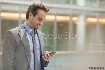 Corporate businessman using smart phone