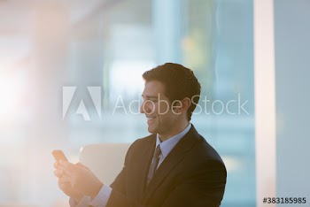 Corporate businessman using smart phone