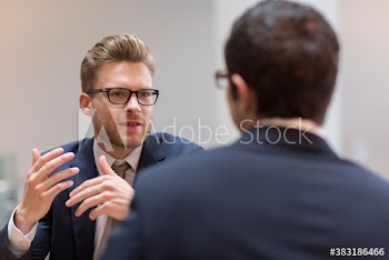 Corporate businessmen talking in meeting