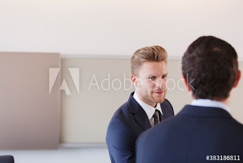 Corporate businessmen talking in meeting