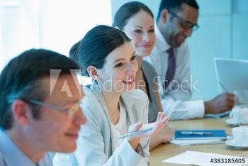 Corporate businesswoman talking in conference room meeting