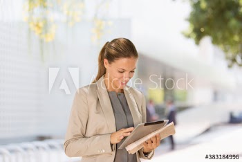 Corporate businesswoman using digital tablet