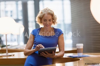 Corporate businesswoman using digital tablet
