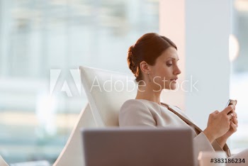 Corporate businesswoman using smart phone