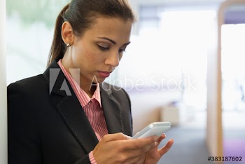 Corporate businesswoman using smart phone