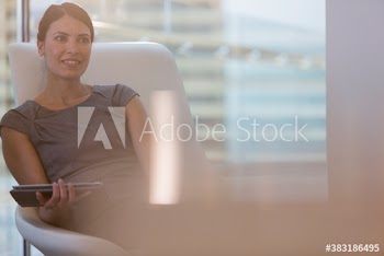 Corporate businesswoman with digital tablet