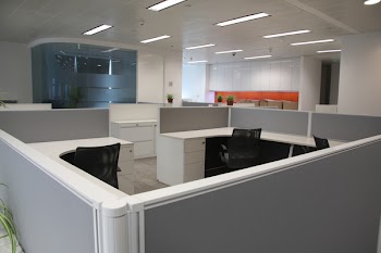 Corporate office settings showing desks, cubicles, files, and conference space