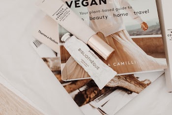 Cosmetic Creams On A Magazine