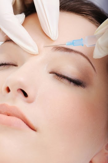 cosmetic injection to the pretty female face - close-up portrait