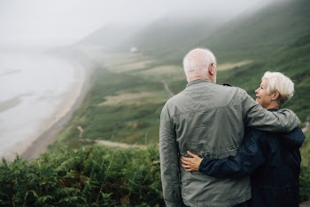 Couple Hands on Shoulder Beside Plant