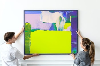 Couple hanging frame, home decor and interior… | Free stock photo | High Resolution image
