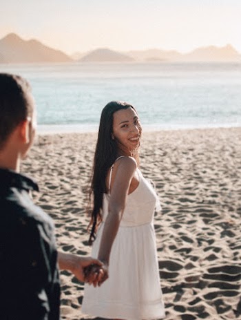 Couple Holding Hands on Beach
