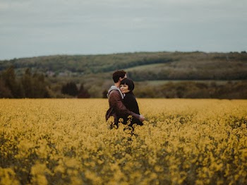 Couple Hugging in the Middle of Flower Field