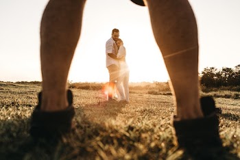 Couple in Grass Field