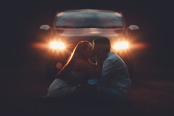Couple Kissing in Front of Car