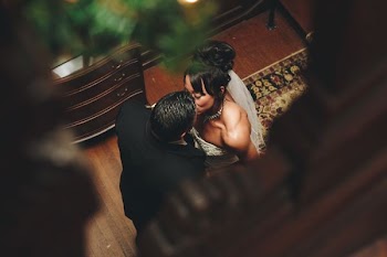 couple kissing near brown wooden chest
