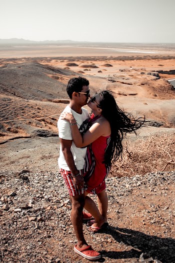 Couple Kissing on Hill