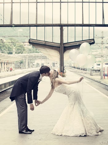 Couple Kissing Standing on the Train Waiting Platform