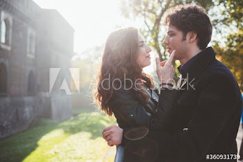 Couple looking at each other while standing outdoors