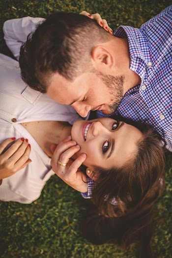 Couple Lying On The Grass