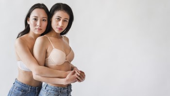 Couple of multiethnic women hugging in lingerie Free Photo