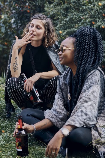 couple of women drinking
