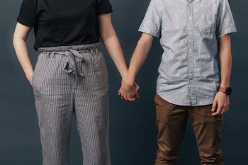 Couple Side By Side Holding Hands