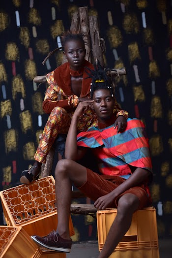 Couple Sitting and Standing on Crates for Photo