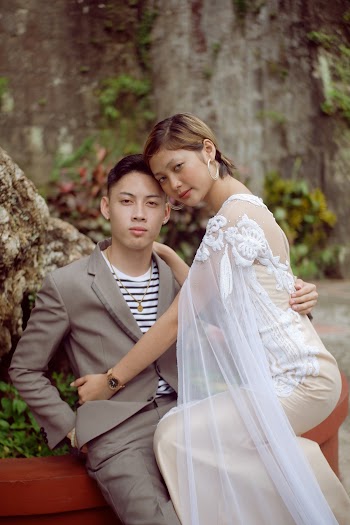 Couple Sitting on Concrete 