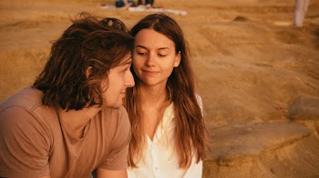 Couple Sitting on Ground