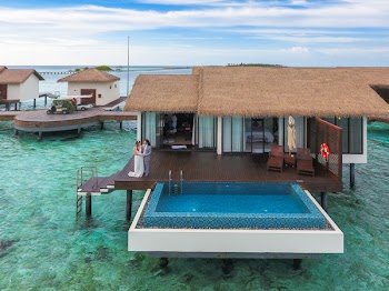 Couple Standing at Maldives Cottage