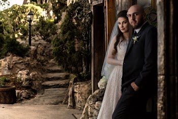 Couple Standing Beside Wall