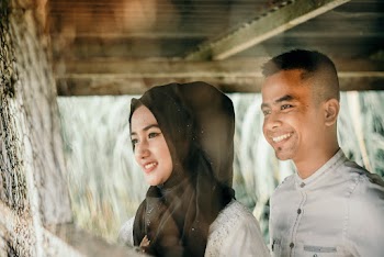 Couple Standing in Room