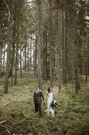 couple standing near trees during daytime