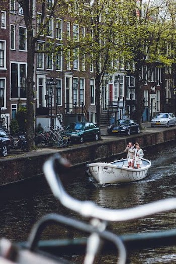 couple standing on boat