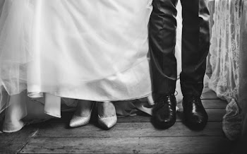 Couple Standing on Wooden Flooring Grayscale Photo