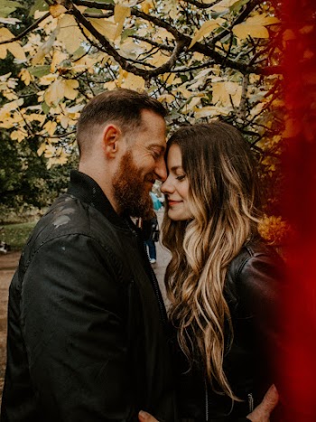 Couple Standing Under Tree