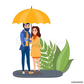 Couple standing under umbrella