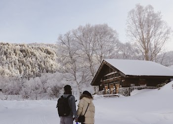 Couple Standing While Holding Hands Near House 