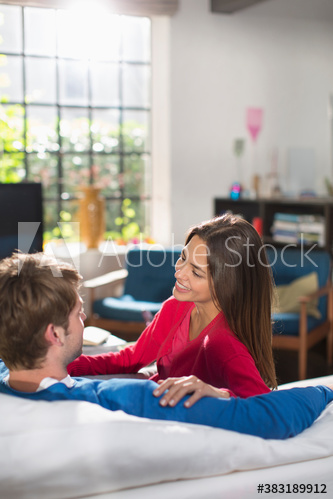 Couple talking on sofa