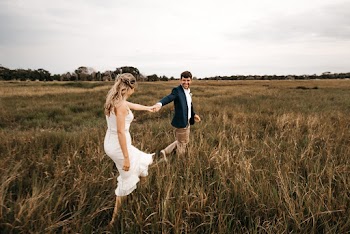Couple Walking on Grass
