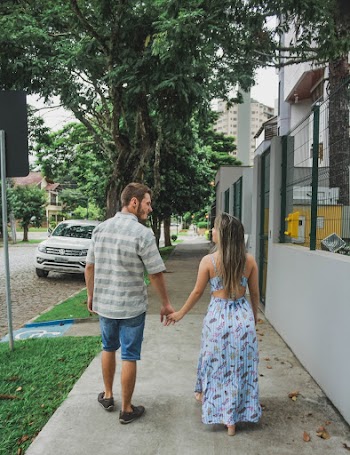 Couple Walking on Pathway Near Vehicle