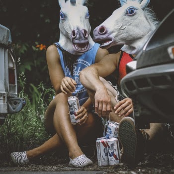Couple Wearing Horse Mask