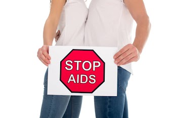 Couple with stop aids banner